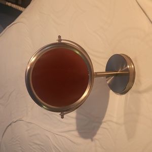 Double-sided vanity mirror, one side magnified.  Silver frame